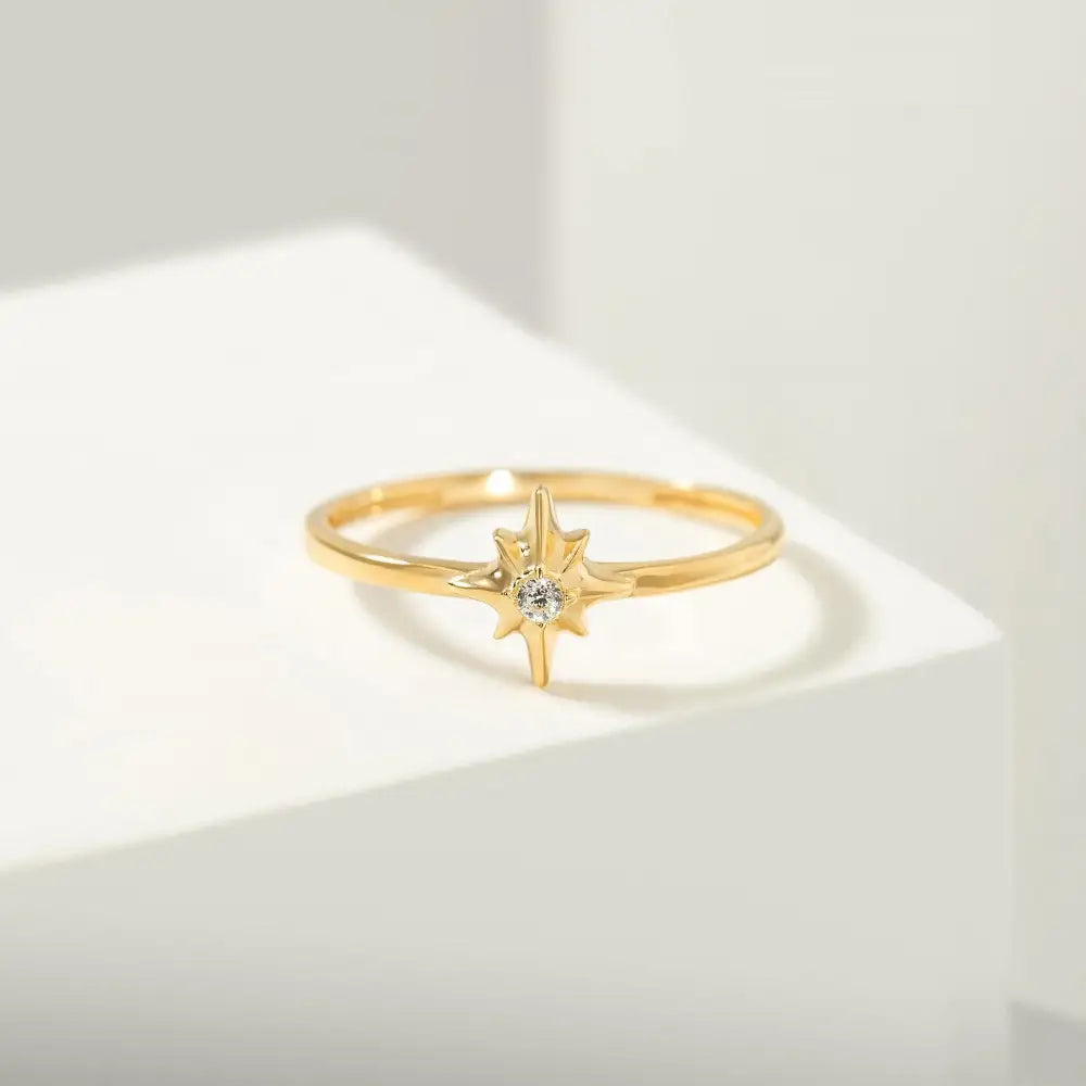 14K North Star Gold Ring Dainty Eight-Point Starburst Design with Sparkling Center Stone